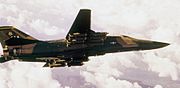 F-111A 428th TFS in flight with cluster bombs.jpg