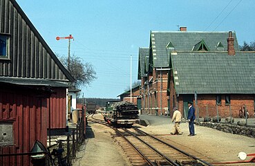 A Train and cart, wagon with cargo on Faxe Railway at Faxe Ladeplads Station.