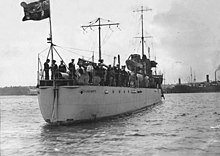 Stern view of Parramatta with crew on deck. The ship is flying the Australian National Flag from the stern instead of a naval ensign. HMAS Parramatta.jpg