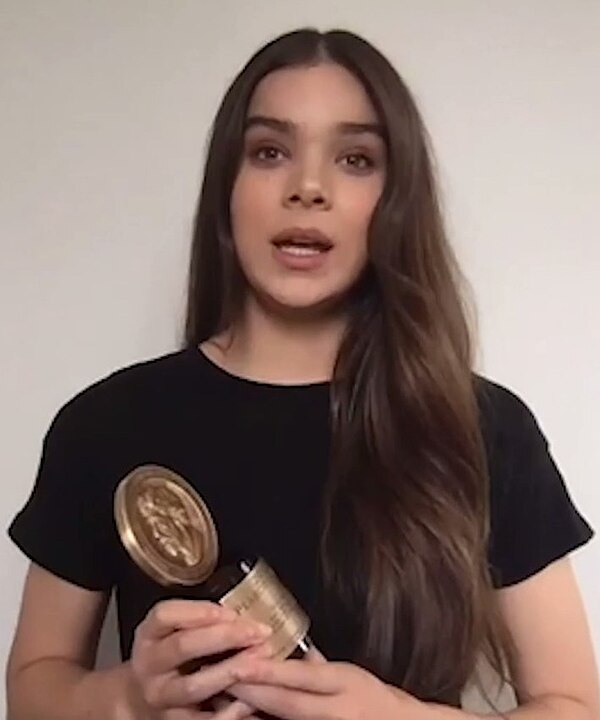 Steinfeld holding the Peabody Award received by Dickinson