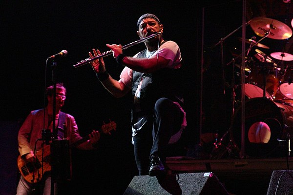 Ian Anderson, the lead vocalist, flautist, acoustic guitarist and principal songwriter of Jethro Tull, performing with the band in Oxfordshire, Englan