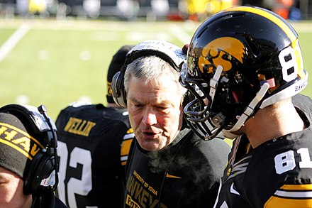 Coach Kirk Ferentz talking to players during a 2013 game
