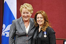 Then Premier of Quebec, the (then) Honourable Pauline Marois, investing Isabelle Boulay as a Knight of the National Order of Quebec Isabelle Boulay07.jpg