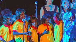 Mauboy performing "Ngarra Burra Ferra" at the 2013 Mbantua Festival in Alice Springs, Northern Territory with Aboriginal Australian students from Yipirinya State Primary School, of which Mauboy is the official ambassador. Jessica Mauboy at Mbantua Festival.jpg