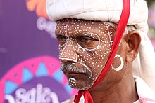 Rathwa man with face painted in Kavant fair in 2018, Gujarat, India. Kavant Fair 90.jpg