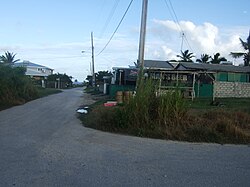 Turn right from the bus route past this Rum Shop.