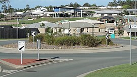 Looking from Jasmine Crescent across new housing developments towards the Mother Teresa Catholic Primary School, Ormeau, 2014.JPG