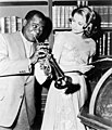 Louis Armstrong and Grace Kelly on the set of "High Society", 1956