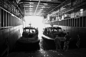 An Inshore Boat Units MESF boats docked onboard another vessel in the Northern Persian Gulf, July 2009 MESF.png