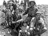 Maghakian with a Japanese soldier's family during the Saipan Campaign in July 1944