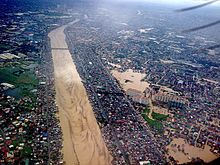 Flooding brought by Typhoon Ketsana (Tropical Storm Ondoy) in 2009 caused 484 deaths in Metro Manila alone. ManggahanFloodwayOndoy.jpg