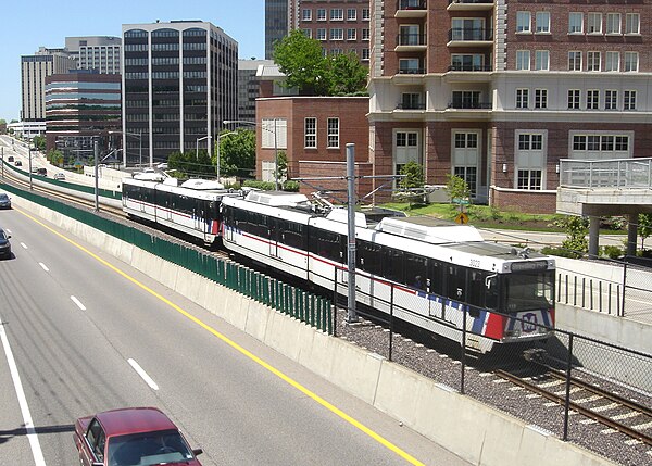 A Blue Line MetroLink train passing through downtown Clayton