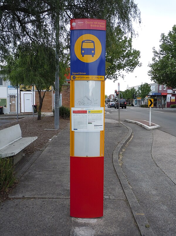 Metrobus blade stop sign at Chester Hill with the name of the stop and a red lower section indicating that the stop is served by Metrobus services