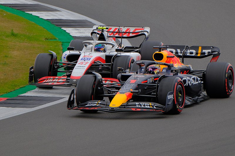 File:Mick Schumacher of Haas battles for position with Red Bull's Max Verstappen en route to his first points finish in F1 at the 2022 British Grand Prix (52196622846).jpg