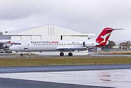 Network Aviation (VH-NHP) Fokker 100, in new Qantaslink "new roo" livery, taxiing at Wagga Wagga Airport (2).jpg