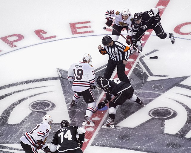  Former NHL referee Marc Joanette prepares for an opening faceoff in a 2013 NHL Western Conference contest between the Chicago Blackhawks and the Los Angeles Kings.