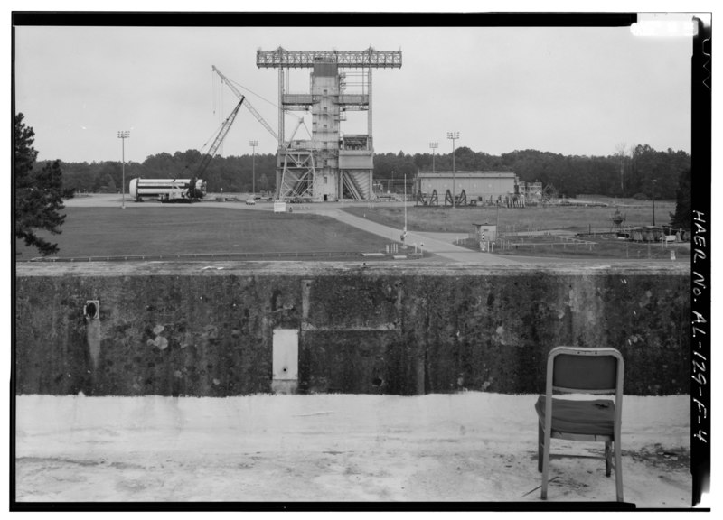 File:PHOTO OF STATIC TEST TOWER FROM OBSERVATION ROOF OF BLOCK HOUSE. NOTE PARAPET WALL OF BLOCK HOUSE IN FOREGROUND. - Marshall Space Flight Center, East Test Area, Block House, HAER ALA,45-HUVI.V,7F-4.tif