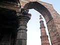 Looking towards the Minar from under the adjoining ruins of an arch.