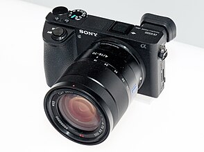Sony Alpha ILCE-6500 front-left 2017 CP + .jpg