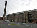 South portion of the east side of Stone Mill, showing the mill's smoke tower. Located near 1 Canal Street, Lawrence, Massachusetts.