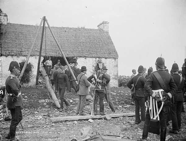 Irish Eviction Vandeleur estate-T.Birmingham's house, Moyasta, County Clare with Battering Ram and soldiers outside July 1888