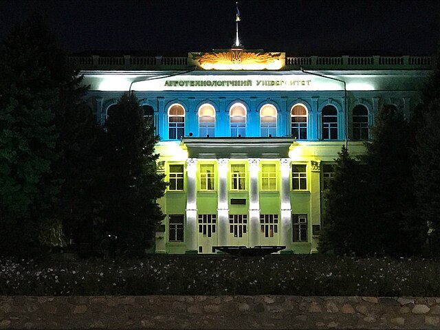 Image: Tavrian state agrotechnological university, Ukraine, main building at night in national colours