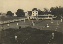 Colonialists on the tennis courts Government House in Lagos., ca.1910 Tennis Courts G.H. Lagos., ca.1910.png