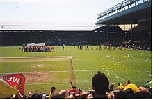 The Spion Kop during a match against Norwich City. It was the last match before it was converted to an all-seater stand.