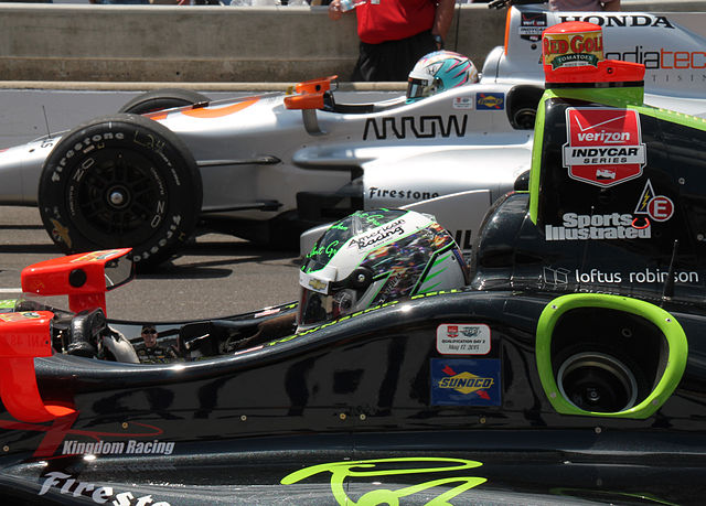 Bell (foreground) participating in the Pit Stop Challenge on Carb Day at the 2015 Indianapolis 500