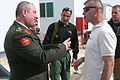 U.S. Marine Corps Maj. Christopher J. Bronzi, right, presents a gift to Jordanian army Col. Hisham Zakha after the Voices of Religious Tolerance (VORT) conference at the Peace Operations Training Center in 110421-M-GW940-104.jpg