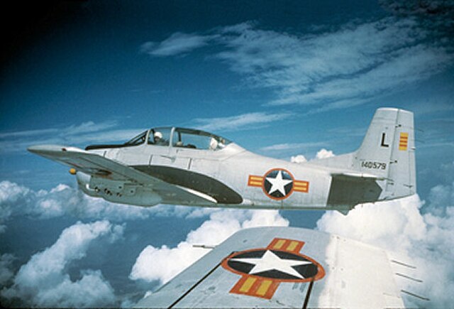 4400th CCTS North American T-28A-NA Trojan Serial, AF Ser. No. 51-3579, wearing Republic of Vietnam Air Force markings flies over Vietnam