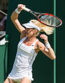 Urszula Radwańska competing in the first round of the 2015 Wimbledon Championships.