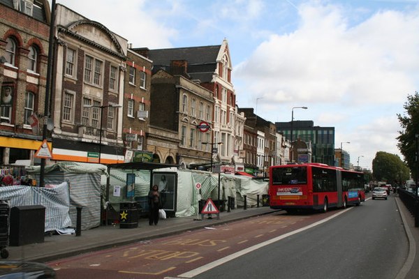 Looking east on Whitechapel Road, near Whitechapel tube station. The street market is on the left.