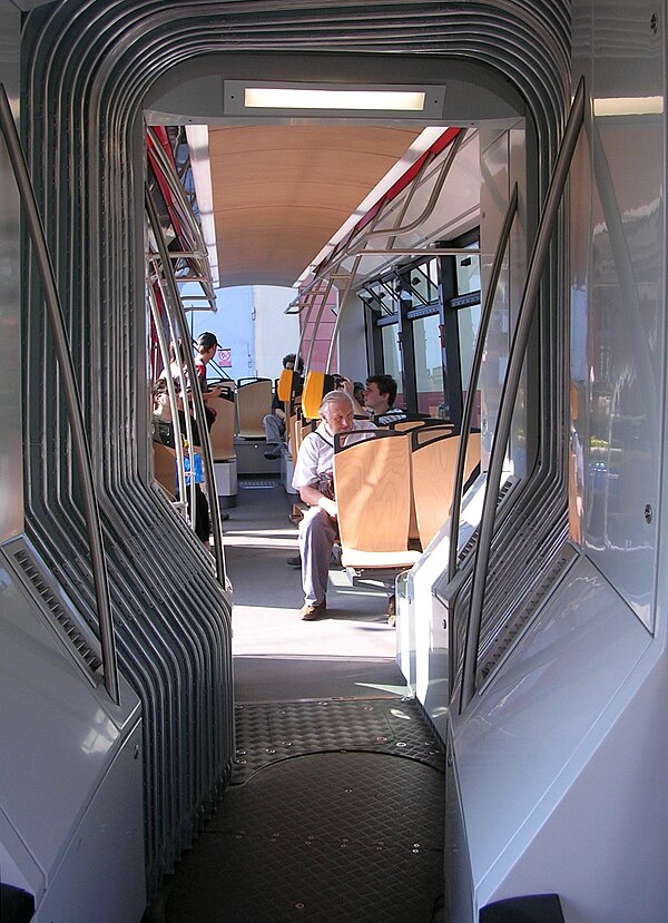 Interior of an articulated tram, showing the pivoting floor and concertina gangway connection