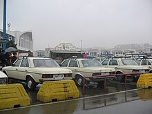 Grand taxi in Tanger port 123-Mercedes 240D, rear, in a row, Taxipuertotanger.jpg