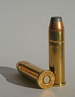 Centerfire ammunition Type of firearm cartridge where the firing pin strikes the primer located in the center of the cartridge case head to fire it
