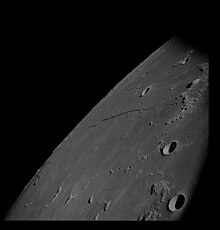 Cauchy is in the upper right quadrant between Rupes Cauchy and Rimae Cauchy in this Apollo 8 image. Omega and Tau Cauchy are visible below the Rupes Cauchy. AS08-13-2344 (21329966194).jpg