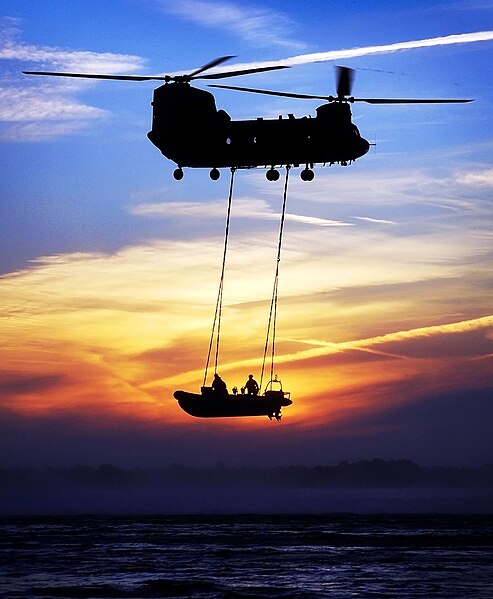 A Royal Marine RIB 'Underslinging', from an RAF Chinook as a method of quick extraction and insertion of waterborne personnel