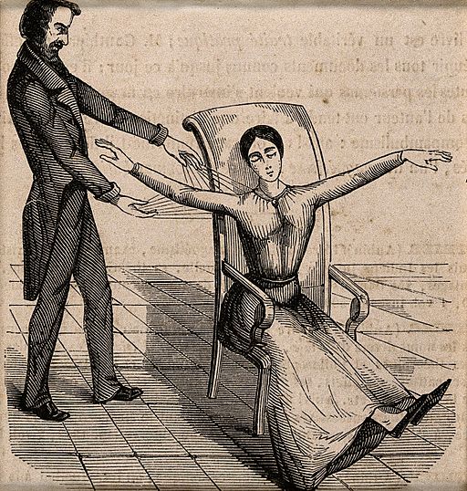 A Mesmerist using Animal Magnetism on a female patient Wellcome V0011094EB