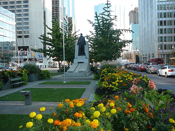 The Adam Beck Memorial is located in the landscaped median, between northbound and southbound lanes just south of Queen Street West