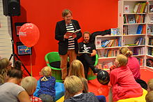 The author reading his book to a young audience