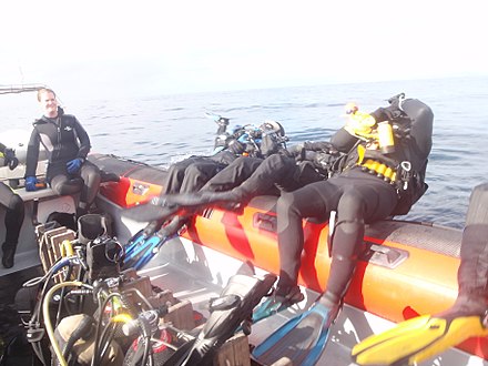 Backward roll water entry from a rigid inflatable dive boat