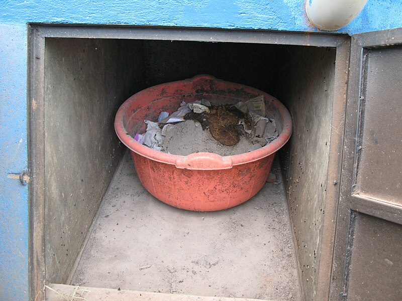 File:Bucket inside of one of the four vaults filled with faeces, ash, toilet paper.jpg