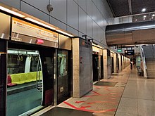 Photograph of the station and a subway car with its doors open