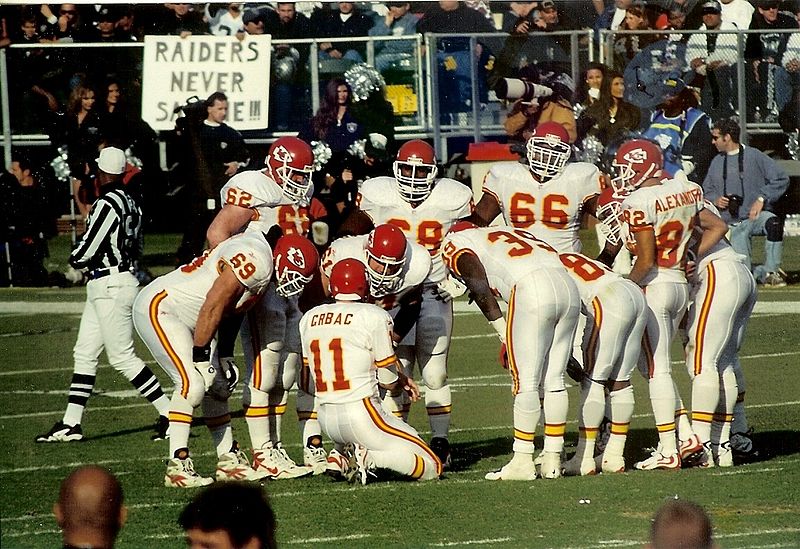 File:Chiefs players in huddle.jpg