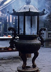 Incense burning at a temple in Taipei, Taiwan Chinese temple incence burner.jpg