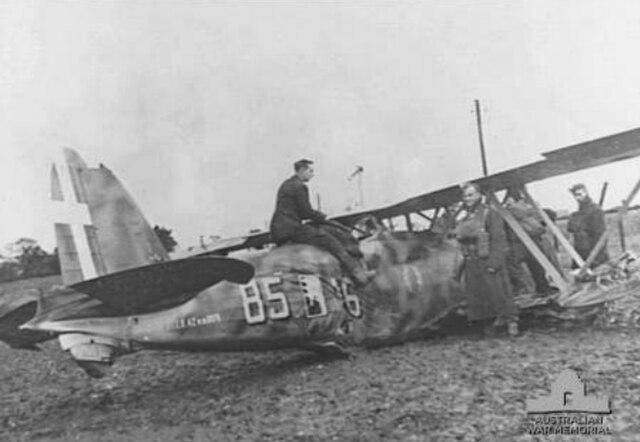 A Falco biplane fighter after crash-landing near Lowestoft, Suffolk on 11 November 1940. The pilot successfully evaded three British Hurricanes, but w