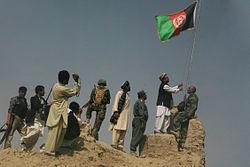 Flag raising over Khan Neshin castle, Rig District, after Operation Khanjar.