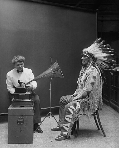 Frances Densmore and Blackfoot chief Mountain Chief working on a recording project of the Bureau of American Ethnology (1916).