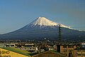 Mount Fuji with an urbanized landscape of Shizuoka prefecture in the foreground